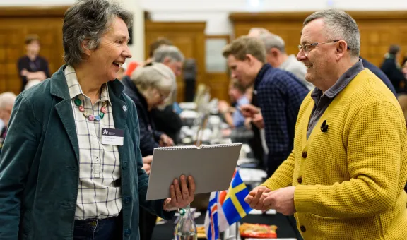 Photograph of Arts Society members chatting 