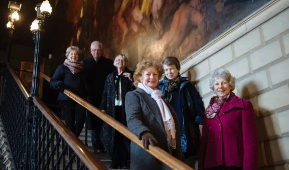 Photograph showing a group of Arts Society members standing on a staircase