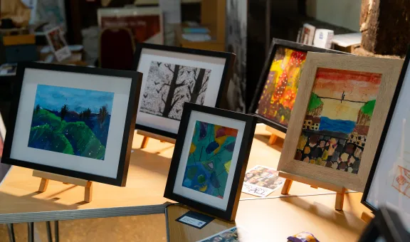 Photograph of paintings on a table