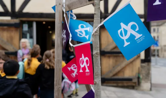 Arts Society Bunting hangs in an outdoor location