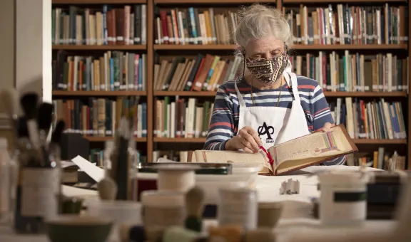 Arts Society Volunteer undertaking book conservation
